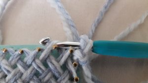 Crochet hook through 2nd sideloop