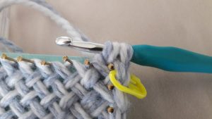 Pull the yarn through the loop