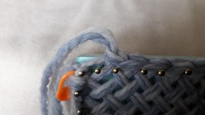 Yarn end pulled through the last stitch