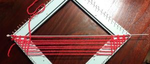 Using a thin knitting needle: weaving