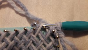 Crochet hook through 2nd sideloop