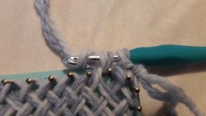Yarn over the crochet hook again